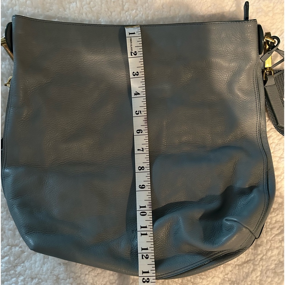 Brand new Fossil tote purse without tags. Never used. Smokey light blue color.